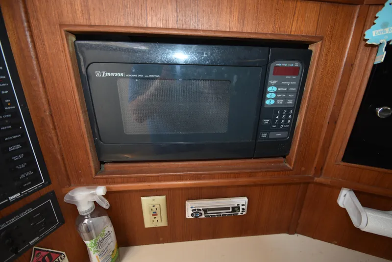 Slide: The Image of Emerson microwave in 1999 Carolina Classic 28 Express boat kitchen. - 20