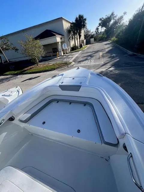 Slide: The Image of Parker 21 SE CC 2025 boat bow in a sunny outdoor setting. - 9