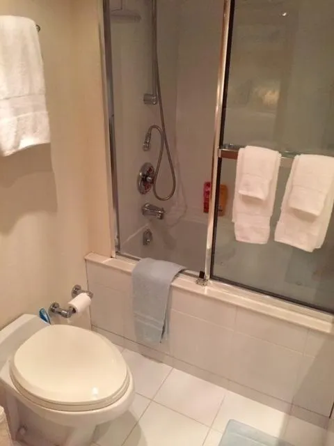 Slide: The Image of Bathroom interior of 1998 Hatteras 74 Sport Deck yacht with shower and towels. - 13