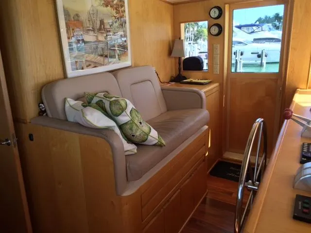 Slide: The Image of Interior of 1998 Hatteras 74 Sport Deck yacht with seating and helm. - 17