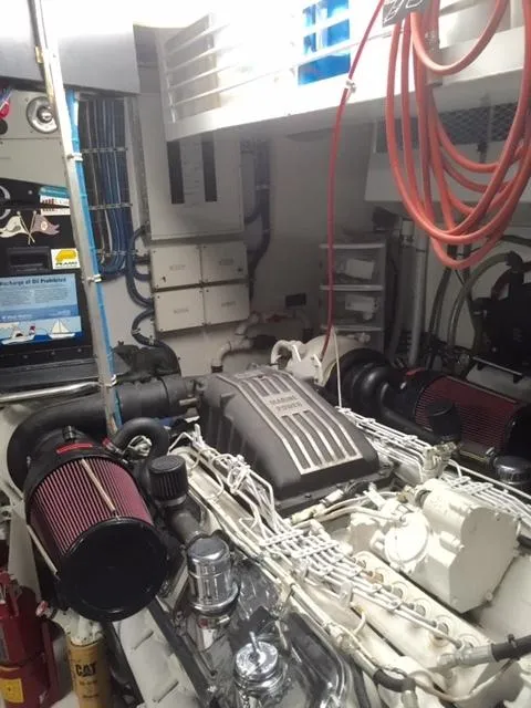 Slide: The Image of Engine room of 1998 Hatteras 74 Sport Deck yacht with visible components and wiring. - 20