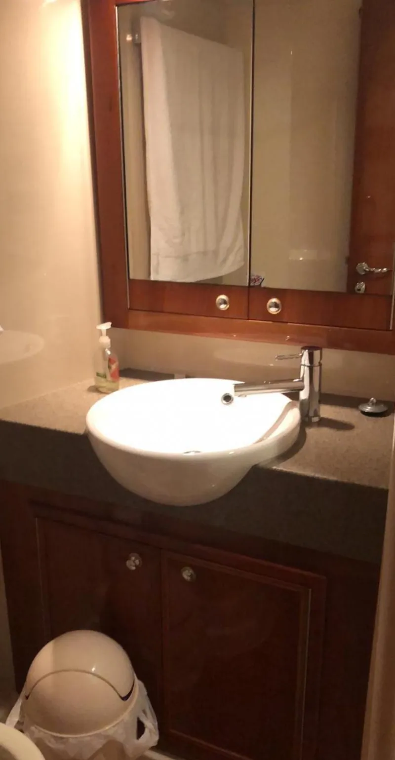 Slide: The Image of Bathroom interior of 2009 Riviera 47 Enclosed Flybridge Series II yacht. - 14
