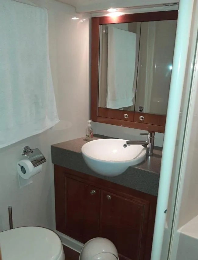Slide: The Image of Bathroom interior of 2009 Riviera 47 Enclosed Flybridge Series II yacht. - 19