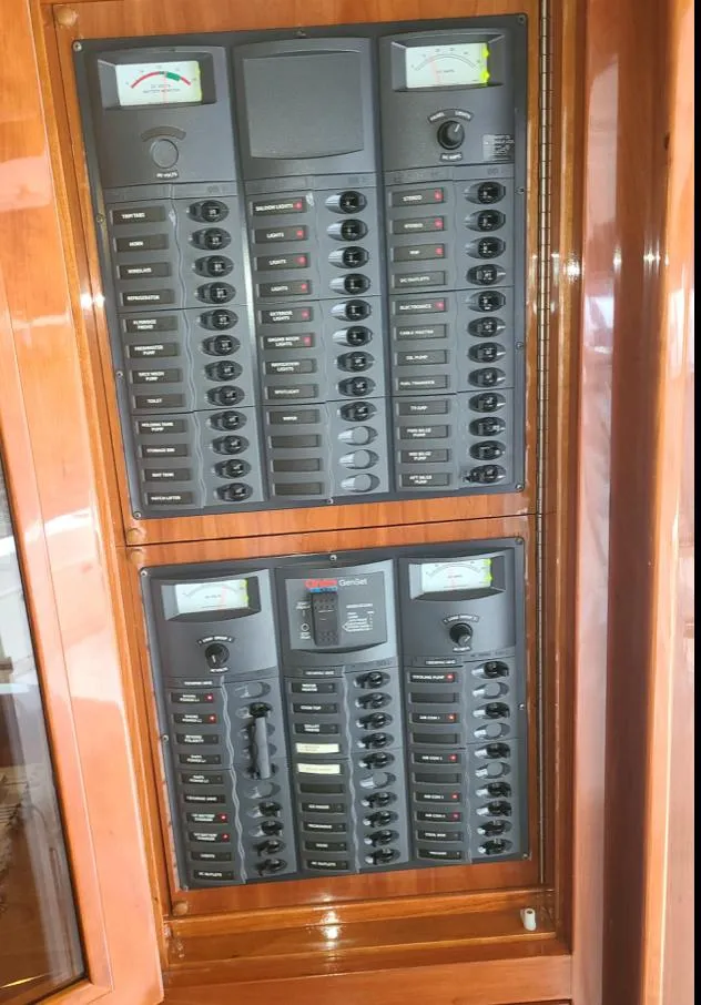 Slide: The Image of Electrical control panel on 2009 Riviera 47 Enclosed Flybridge Series II yacht. - 31