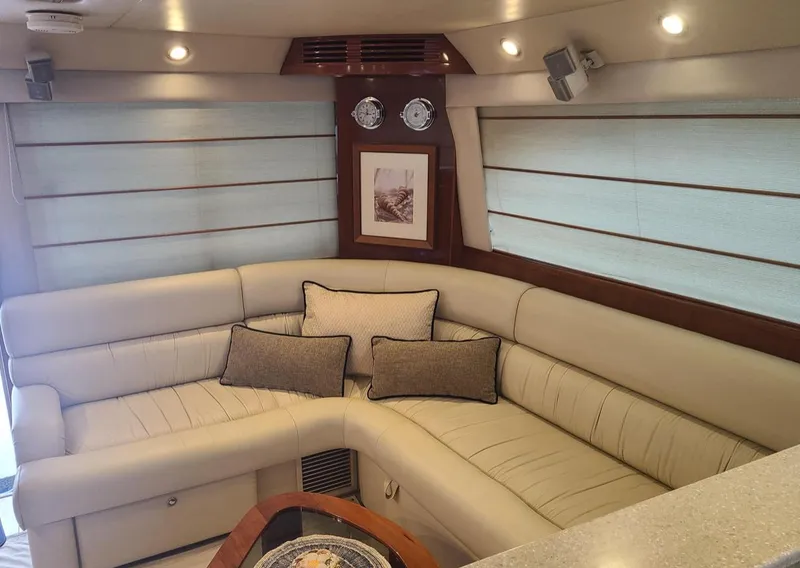 Slide: The Image of Luxurious interior of 2009 Riviera 47 Enclosed Flybridge Series II yacht with plush seating. - 35