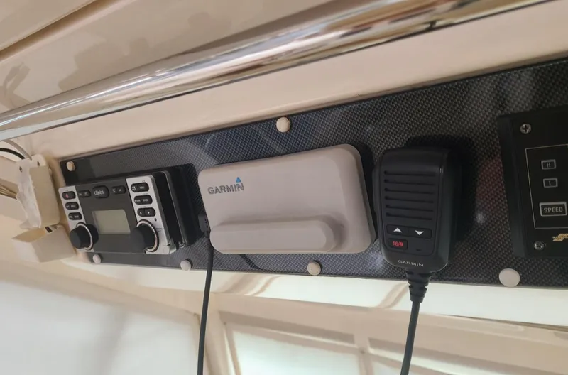 Slide: The Image of Control panel of 2009 Riviera 47 Enclosed Flybridge Series II with Garmin equipment. - 37