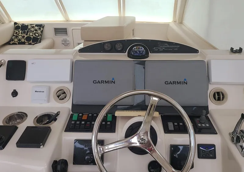 Slide: The Image of Control panel of 2009 Riviera 47 Enclosed Flybridge Series II with Garmin navigation displays. - 41