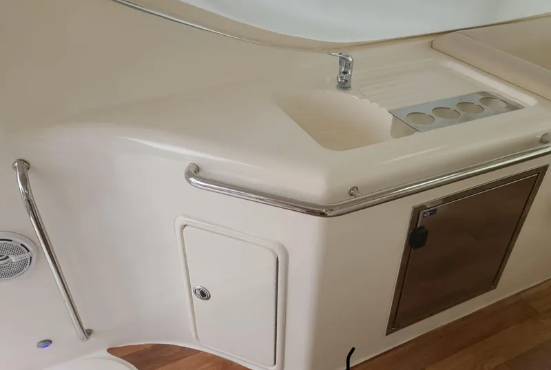 Slide: The Image of 2009 Riviera 47 Enclosed Flybridge Series II yacht interior with sink and storage. - 44