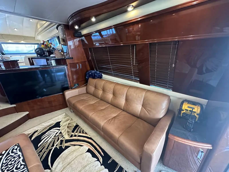 Slide: The Image of Luxurious interior of a 2004 Marquis 59 yacht with leather sofa and modern decor. - 11