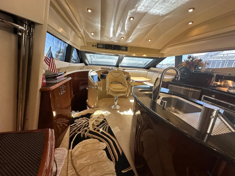 Slide: The Image of Luxurious interior of a 2004 Marquis 59 yacht with elegant furnishings and modern amenities. - 14