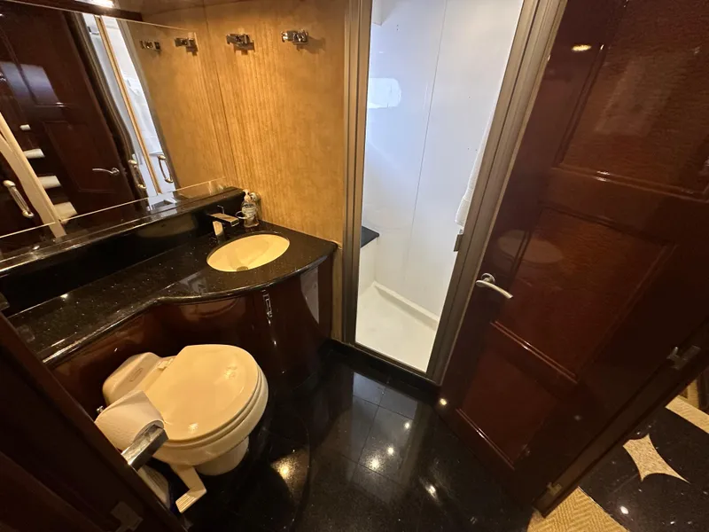 Slide: The Image of Luxurious 2004 Marquis 59 yacht bathroom with modern fixtures and elegant design. - 24