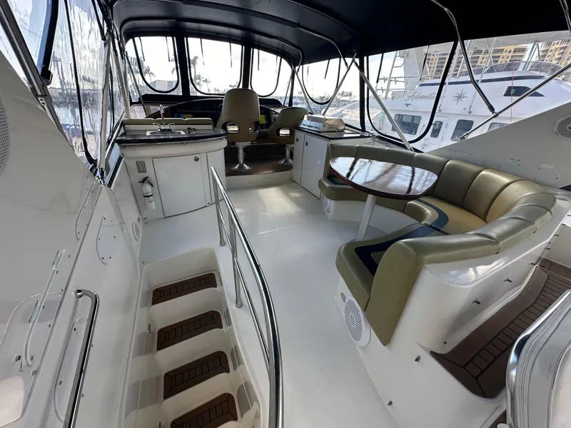 Slide: The Image of Luxurious 2004 Marquis 59 yacht interior with seating and helm area. - 28