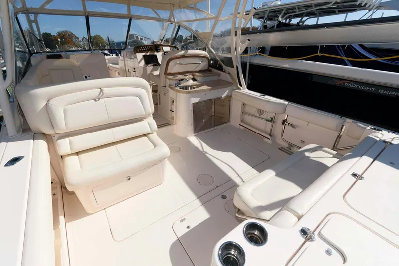 Slide: The Image of 2015 Grady-White Freedom 335 boat interior with spacious seating and helm station. - 11