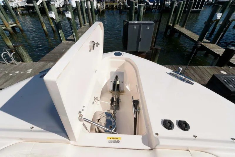 Slide: The Image of 2015 Grady-White Freedom 335 boat anchor compartment at marina dock. - 13