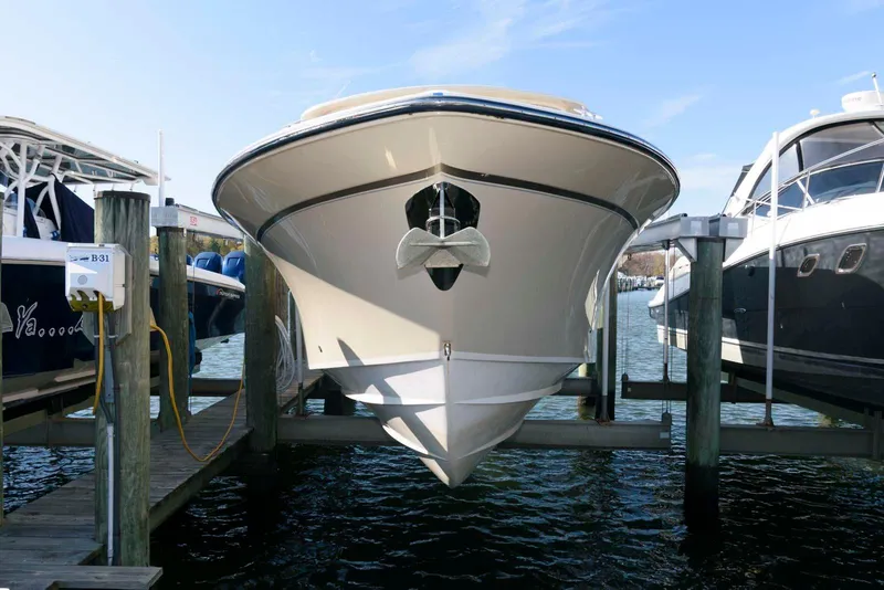 Slide: The Image of 2015 Grady-White Freedom 335 boat docked at marina, front view. - 3