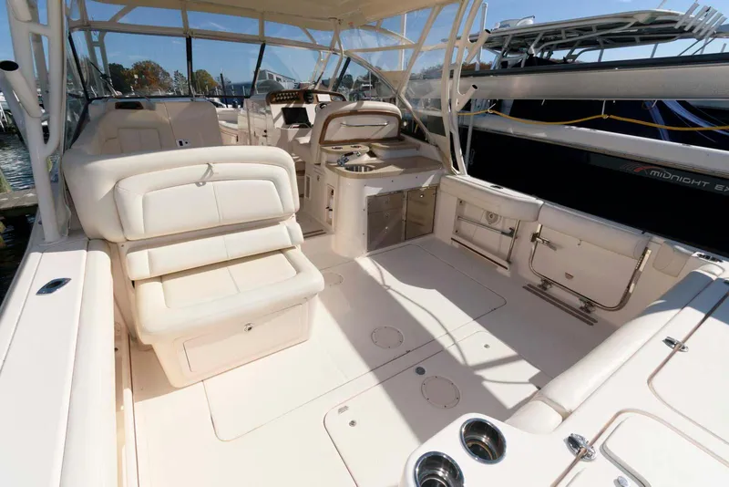 Slide: The Image of 2015 Grady-White Freedom 335 boat interior with seating and helm station. - 6