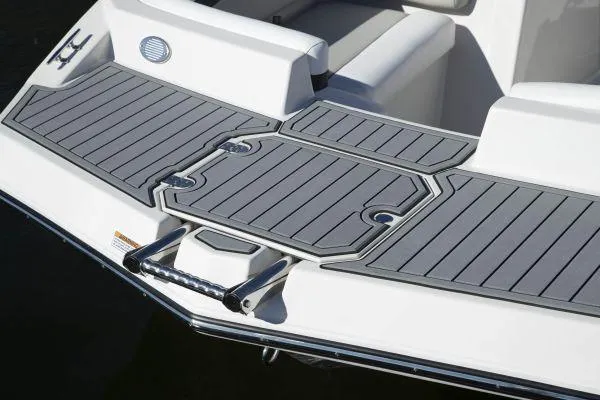 Slide: The Image of 2025 Starcraft SVX 190 OB boat with sleek gray deck and swim platform. - 9