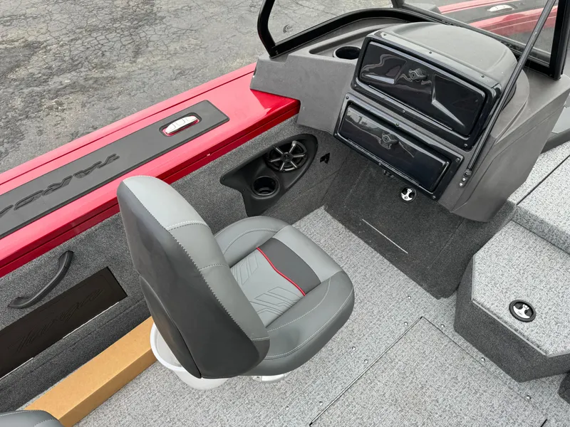 Slide: The Image of 2024 Tracker Targa V-18 Combo boat interior with gray seat and dashboard. - 10