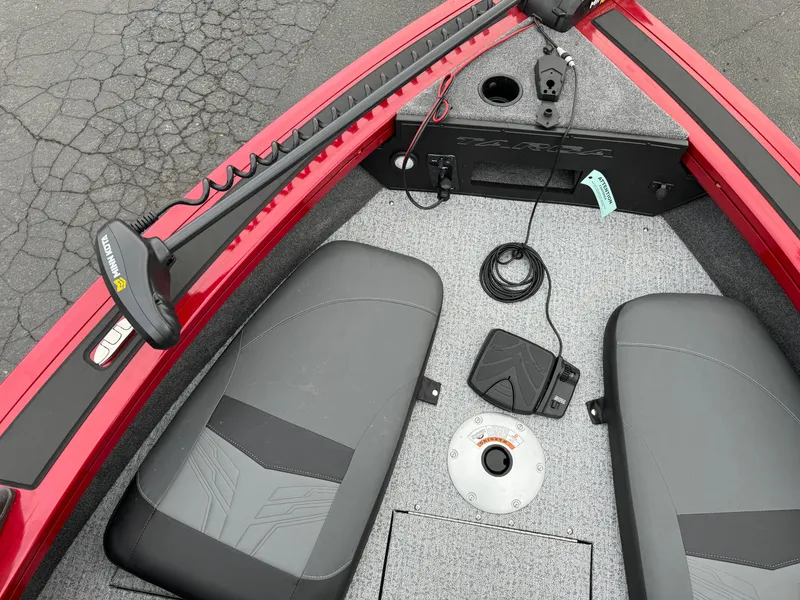 Slide: The Image of 2024 Tracker Targa V-18 Combo boat interior with seating and control panel. - 16