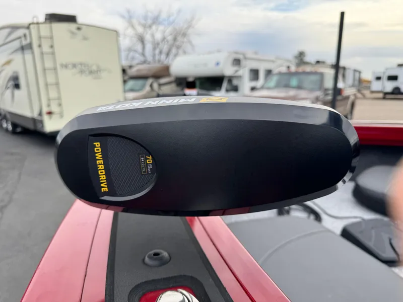 Slide: The Image of 2024 Tracker Targa V-18 Combo boat with PowerDrive motor in a parking lot. - 17