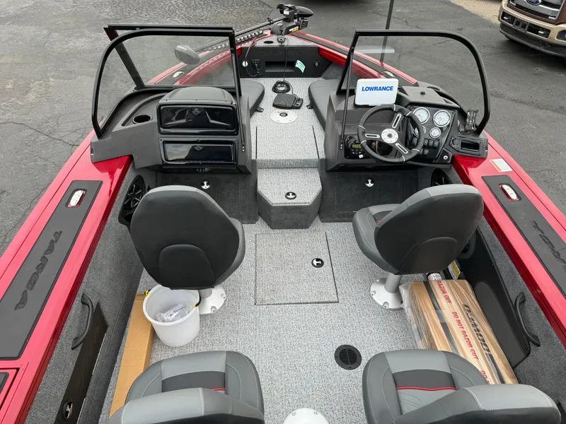 Slide: The Image of 2024 Tracker Targa V-18 Combo boat interior with dual consoles and seating. - 18