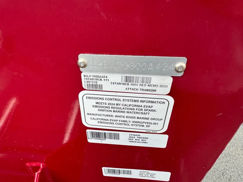 Slide: The Image of 2024 Tracker Targa V-18 Combo emissions control information label on red surface. - 5