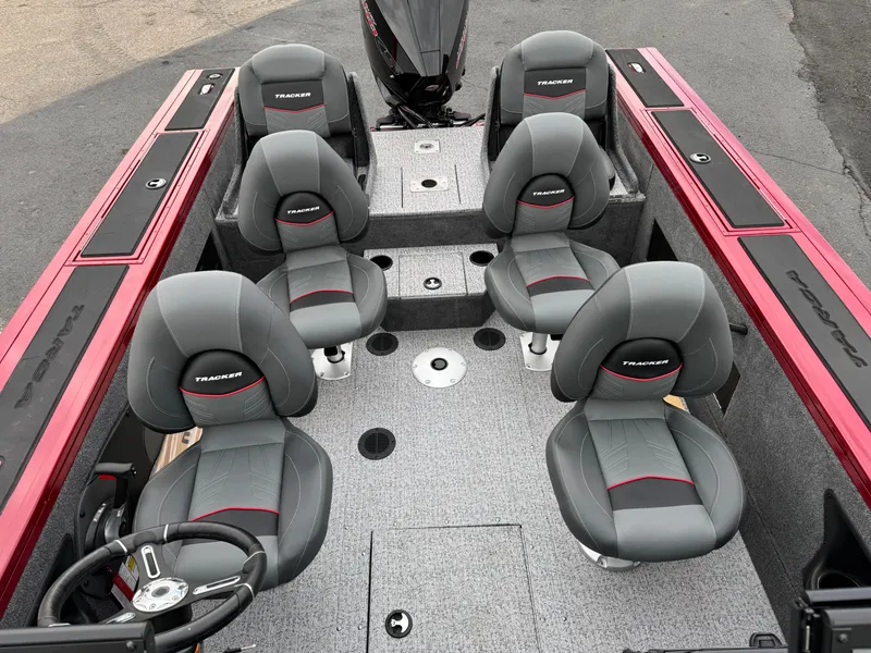 Slide: The Image of 2024 Tracker Targa V-18 Combo boat interior with six seats and steering wheel. - 6