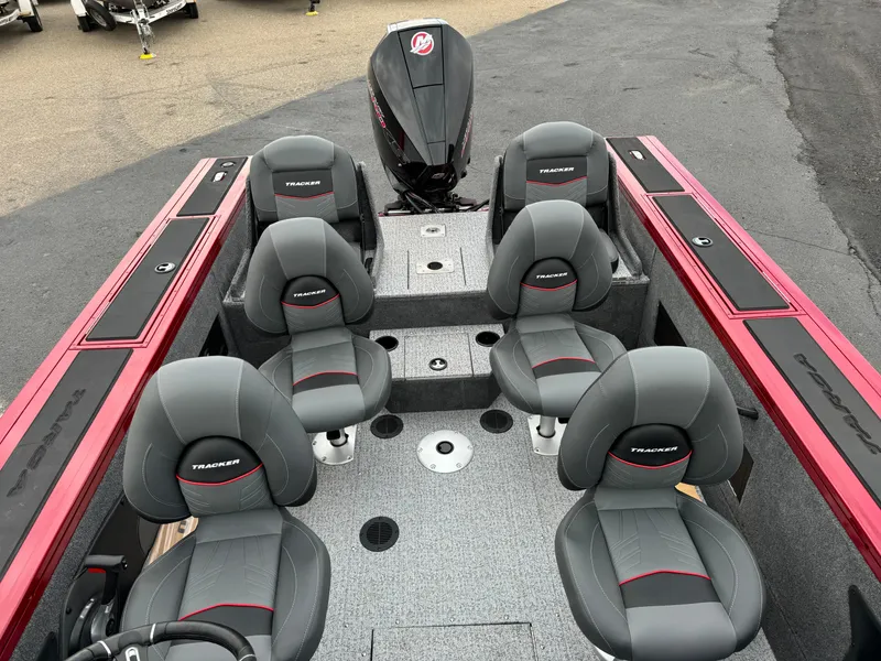 Slide: The Image of 2024 Tracker Targa V-18 Combo boat interior with six seats and motor. - 7