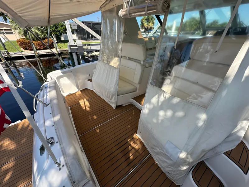 Slide: The Image of 2005 Tiara Yachts 3600 Sovran with teak deck and covered seating area. - 16