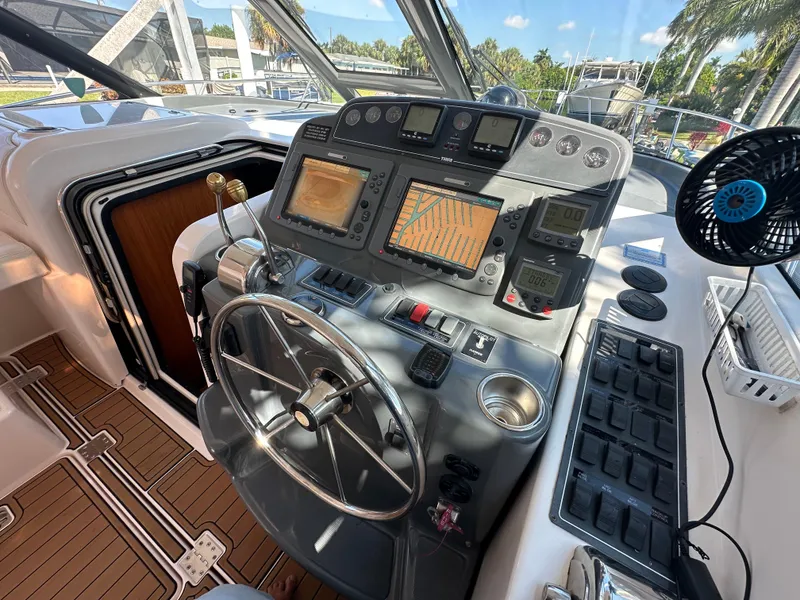 Slide: The Image of Control panel of 2005 Tiara Yachts 3600 Sovran with navigation screens and steering wheel. - 25