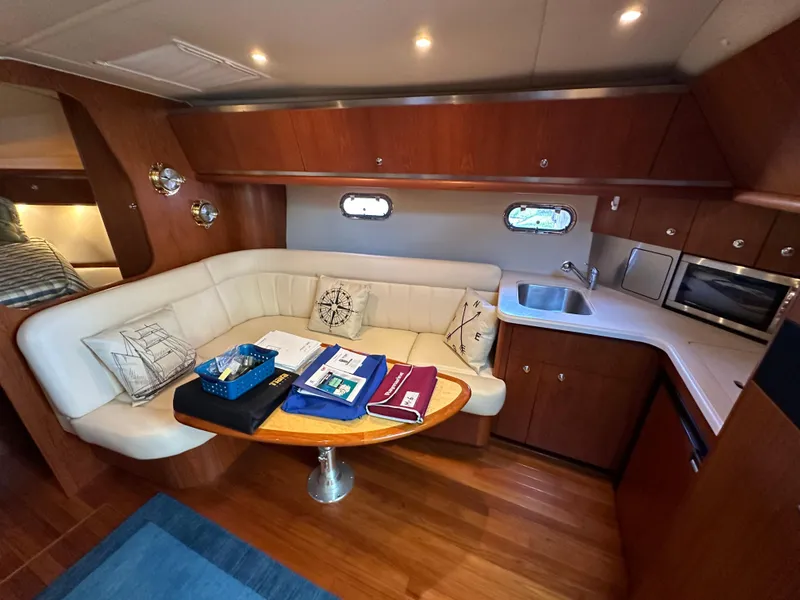 Slide: The Image of Interior of 2005 Tiara Yachts 3600 Sovran with cozy seating and kitchenette. - 29