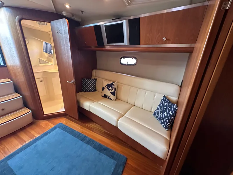 Slide: The Image of Interior of 2005 Tiara Yachts 3600 Sovran with leather seating and nautical decor. - 33