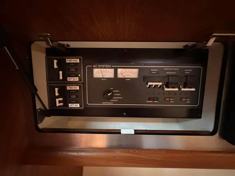 Slide: The Image of Control panel of 2005 Tiara Yachts 3600 Sovran, featuring AC system switches and indicators. - 35