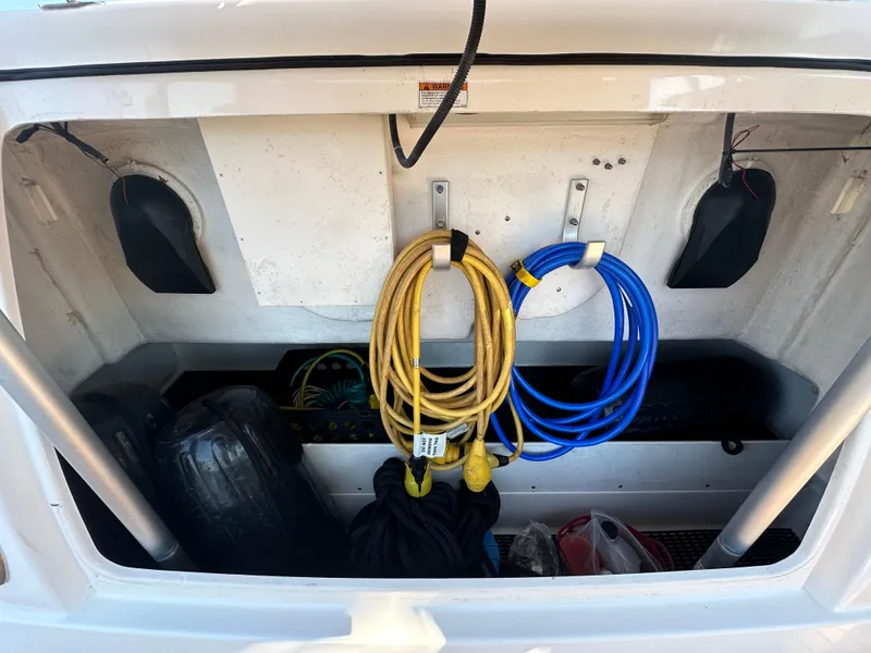 Slide: The Image of Storage compartment of 2005 Tiara Yachts 3600 Sovran with ropes and equipment. - 4
