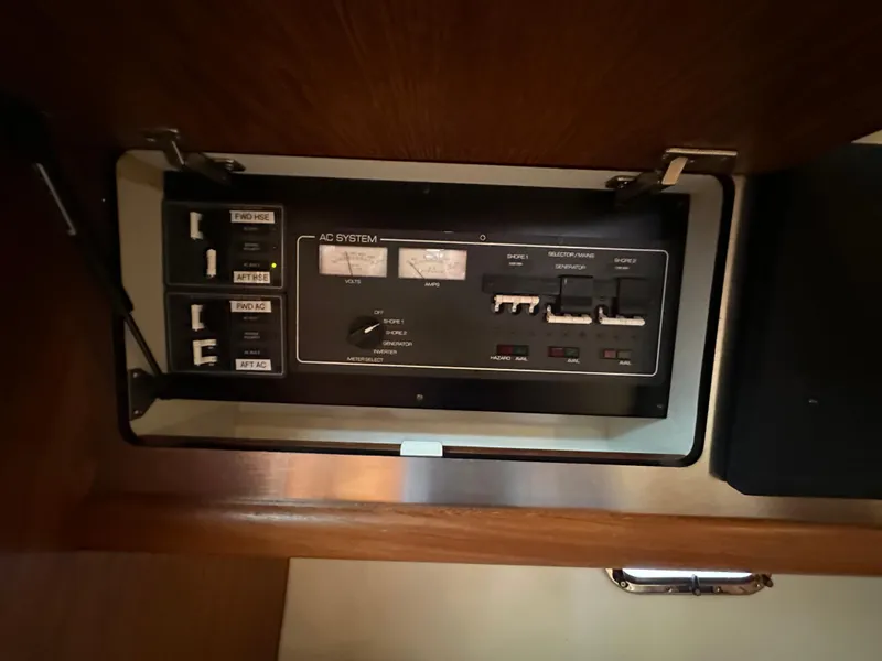 Slide: The Image of 2005 Tiara Yachts 3600 Sovran AC system control panel. - 46