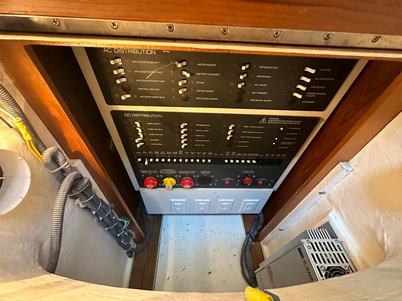 Slide: The Image of Electrical panel of 2005 Tiara Yachts 3600 Sovran, showcasing AC and DC distribution systems. - 48
