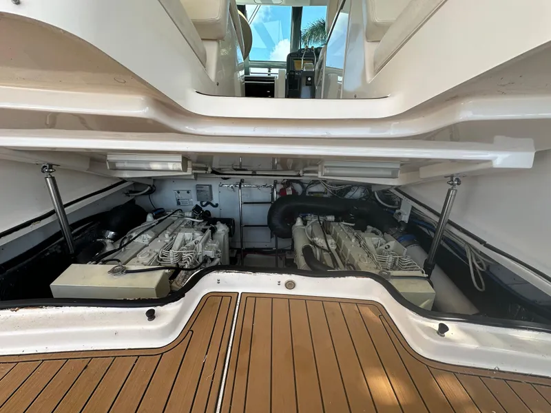 Slide: The Image of Engine compartment of 2005 Tiara Yachts 3600 Sovran with twin engines and teak flooring. - 49