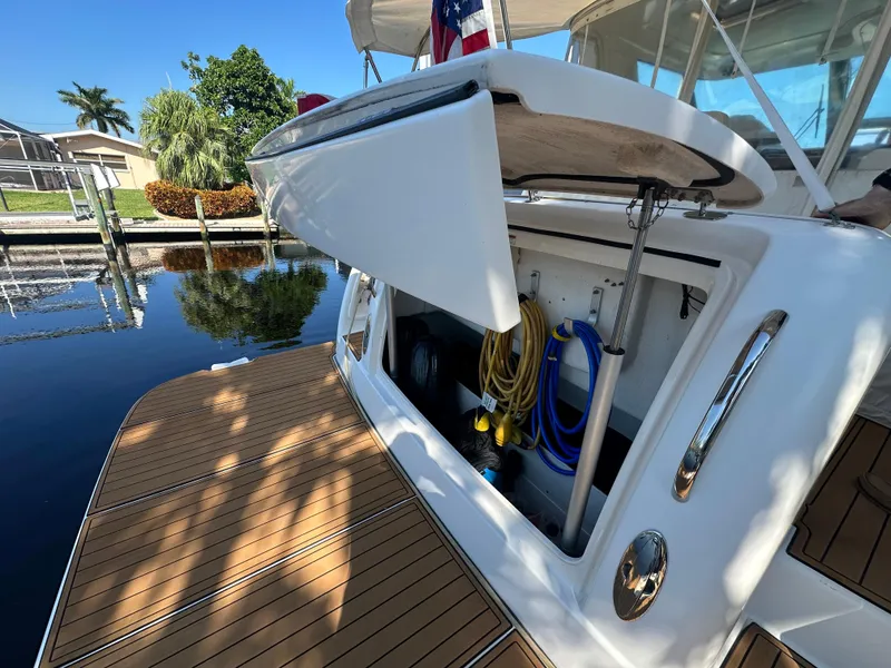 Slide: The Image of 2005 Tiara Yachts 3600 Sovran with open storage compartment on teak deck. - 5