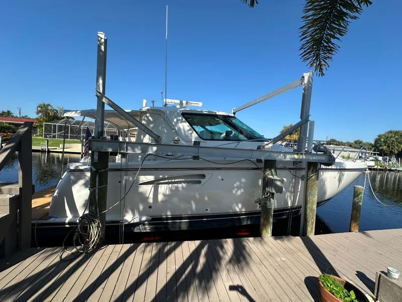 Slide: The Image of 2005 Tiara Yachts 3600 Sovran docked by a sunny waterfront. - 7