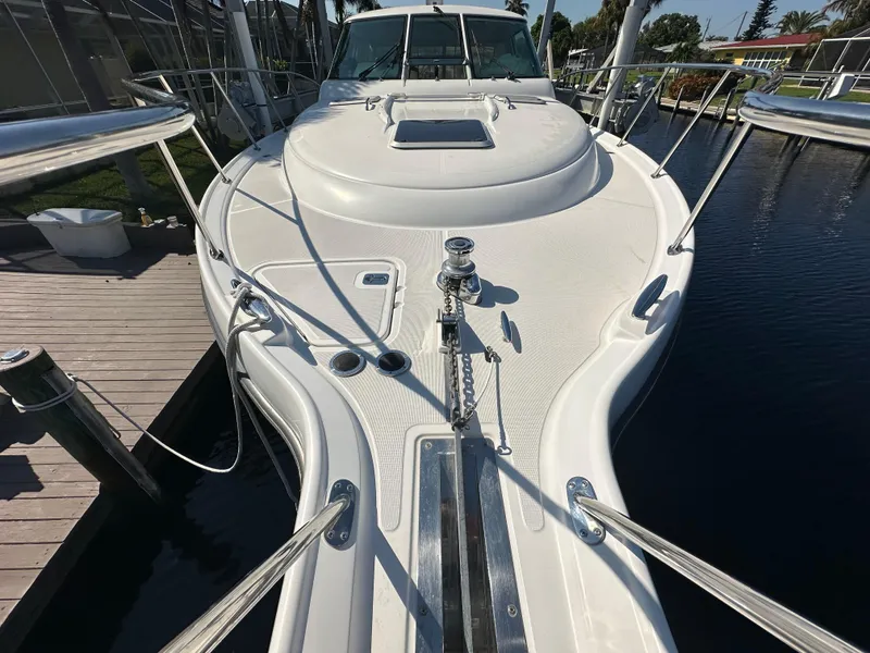 Slide: The Image of 2005 Tiara Yachts 3600 Sovran, white deck, docked at marina. - 9