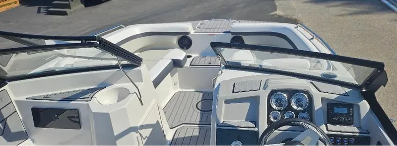 Slide: The Image of 2025 Starcraft SVX 210 DC boat interior with modern dashboard and seating. - 4