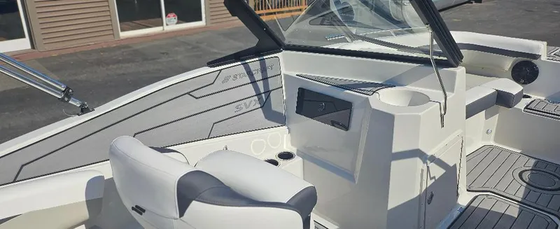 Slide: The Image of 2025 Starcraft SVX 210 DC boat interior with modern seating and dashboard design. - 7