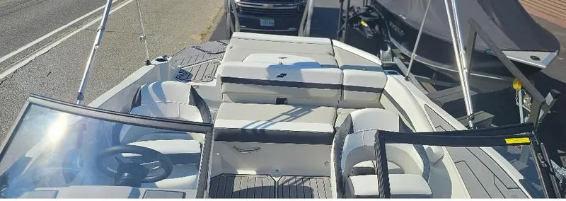 Slide: The Image of 2025 Starcraft SVX 210 DC boat with sleek seating and modern design. - 8