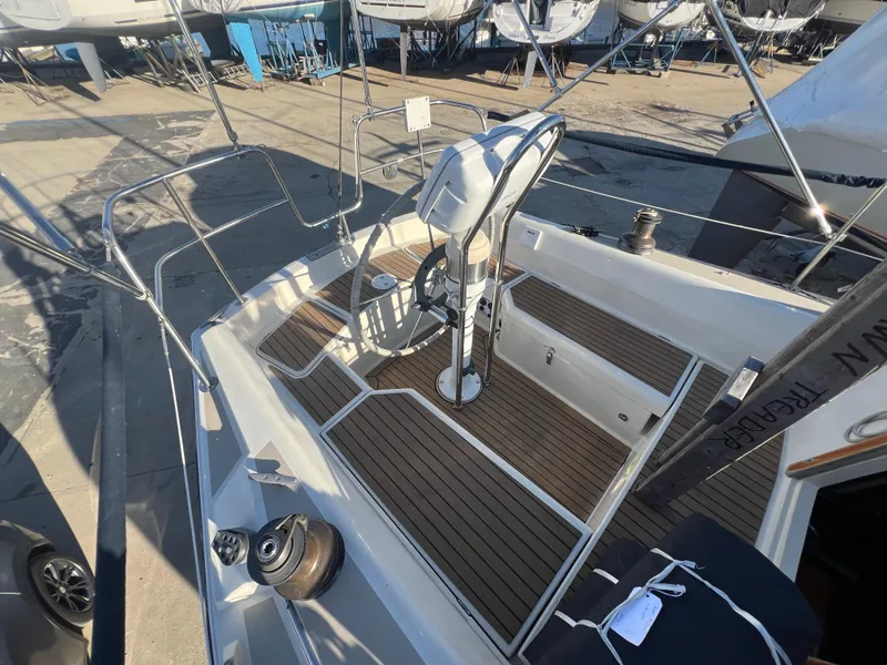 Slide: The Image of 1983 O'Day 34 sailboat cockpit with wooden deck and steering wheel. - 14