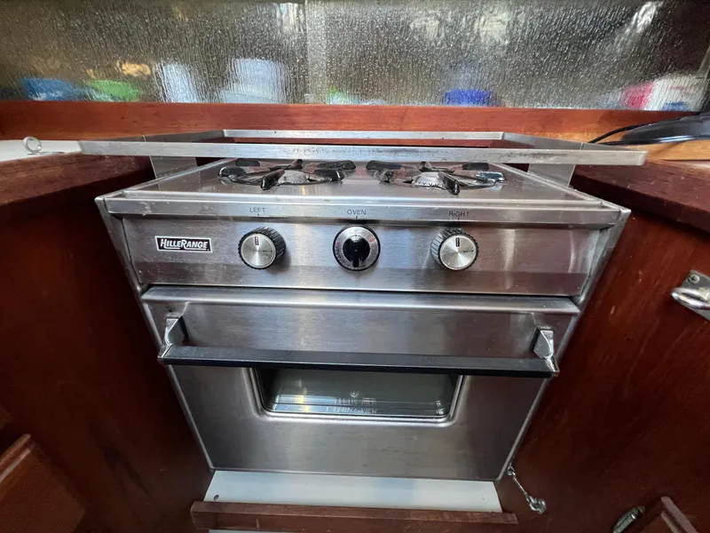 Slide: The Image of Stainless steel marine stove in 1983 O'Day 34 sailboat galley. - 21