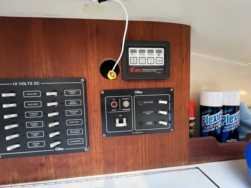 Slide: The Image of Control panel of a 1983 O'Day 34 sailboat with Plexus cleaner bottles. - 29