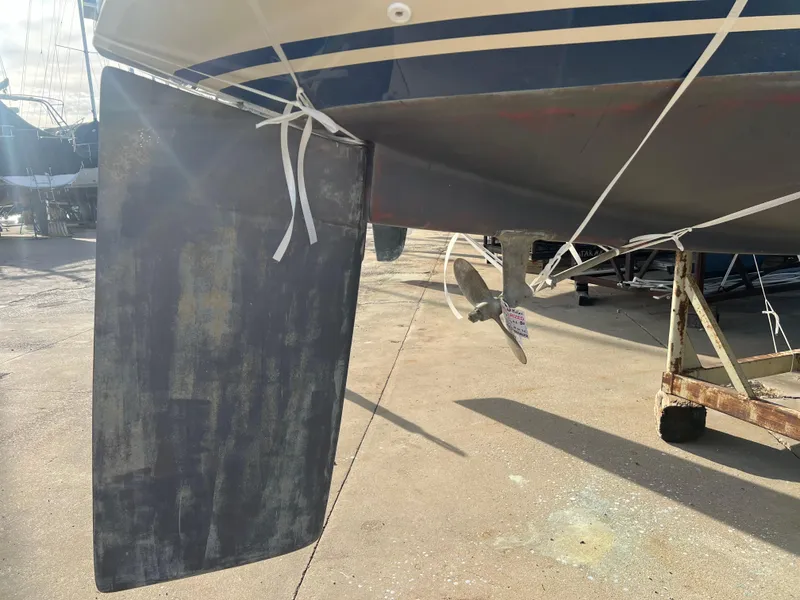Slide: The Image of 1983 O'Day 34 sailboat rudder and propeller on dry dock. - 41