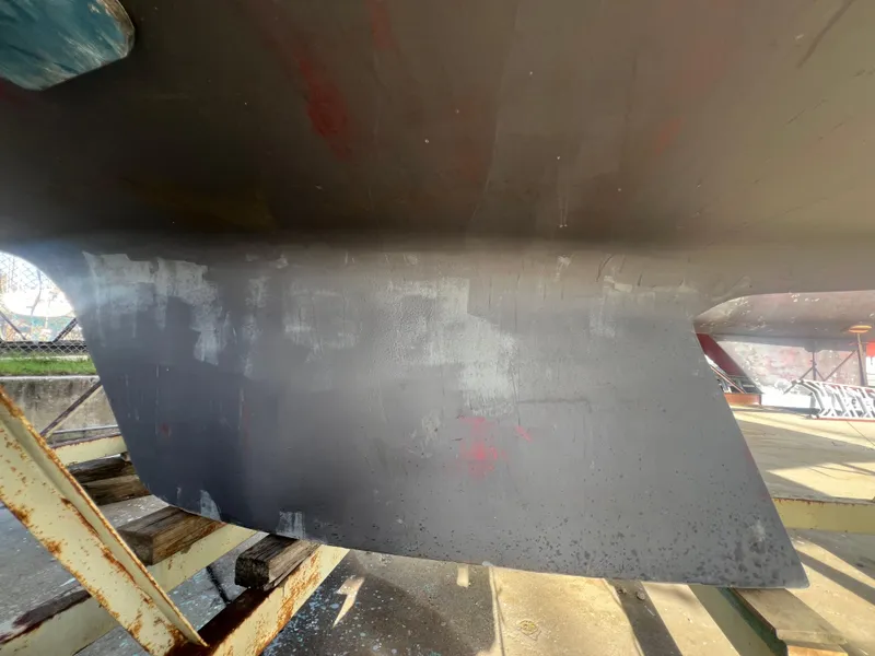 Slide: The Image of Close-up of 1983 O'Day 34 sailboat keel on dry dock. - 43