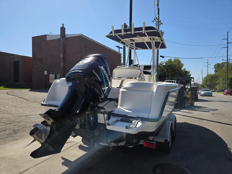 Slide: The Image of 2004 Boston Whaler 210 Outrage boat with Mercury outboard motor on trailer. - 9