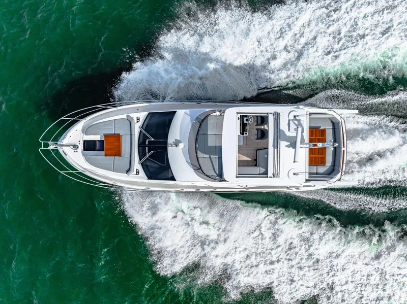 Slide: The Image of Aerial view of 2021 Sunseeker Manhattan 55 yacht cruising on open water. - 23